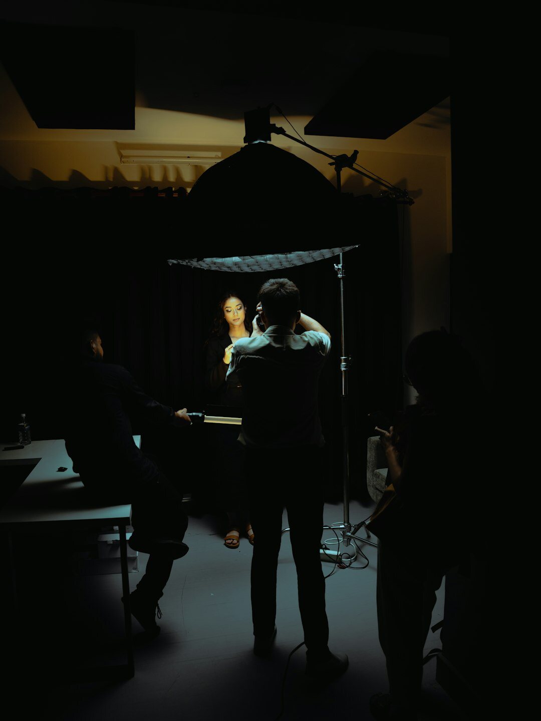 Production crew working behind the scenes in a studio